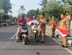 Disnaketrans bersama Forum HRD Muba bagikan Bendera Merah Putih Untuk Warga